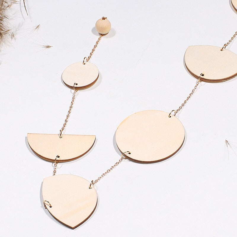 Dekoracja ścienna z fazami księżyca z drewna