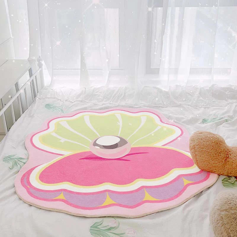 Różowy dywanik dekoracyjny w kształcie muszli