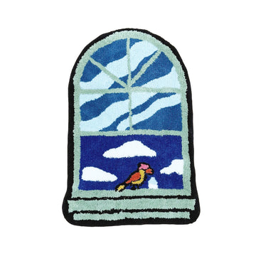 Sztuczny dywan z wszurkanym wzorem na oknie